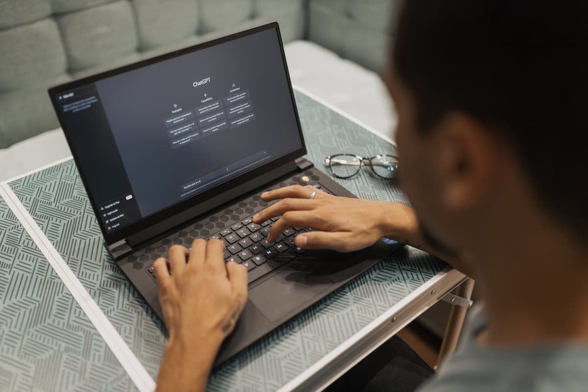 Person using AI technology on laptop — illustrating AI agents in practice