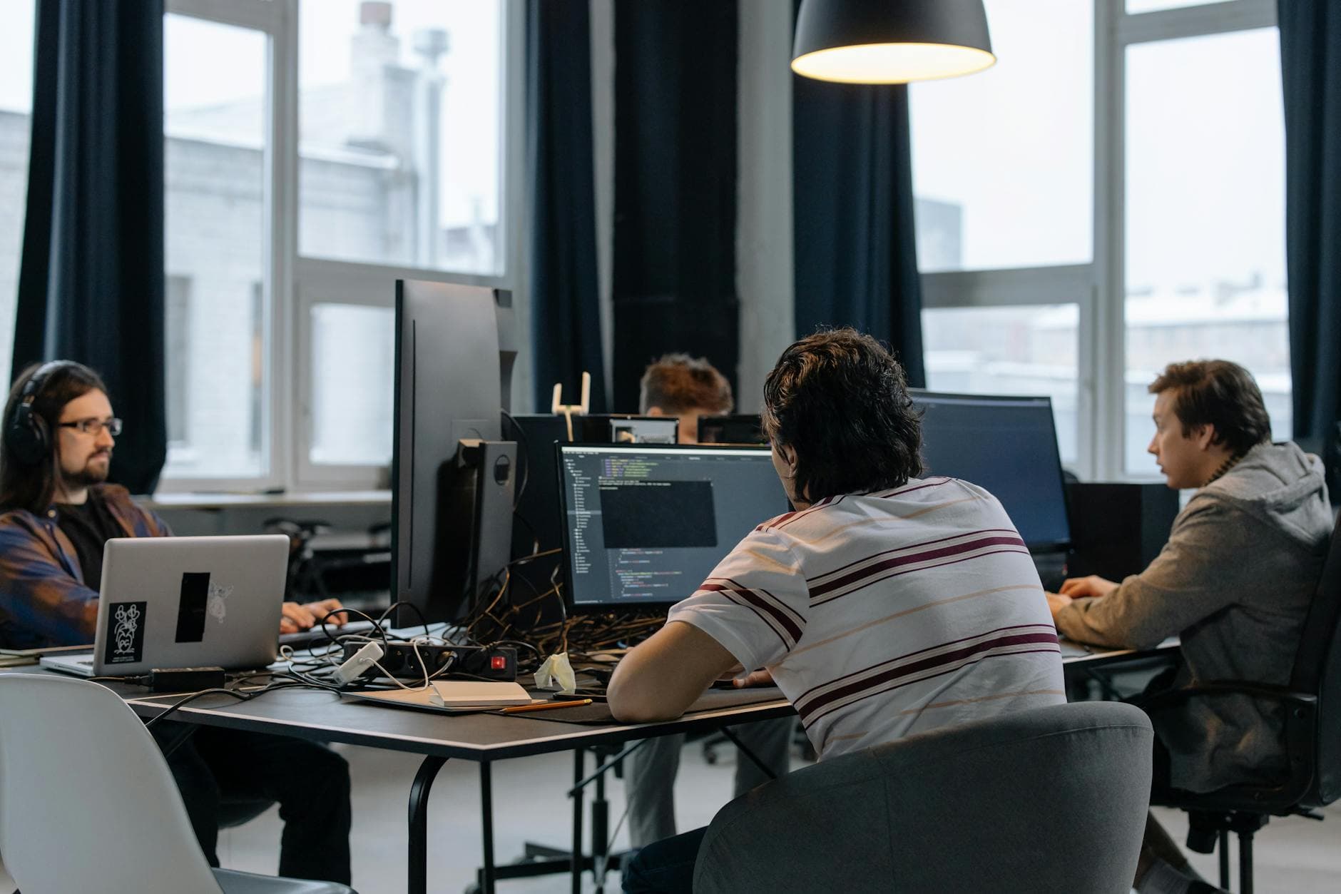Modern office with screens and technology — symbolizing AI agents in enterprise operations