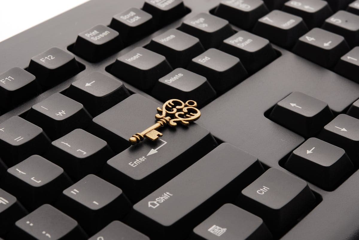 Vintage key on keyboard — symbolizing security and access control for AI agents