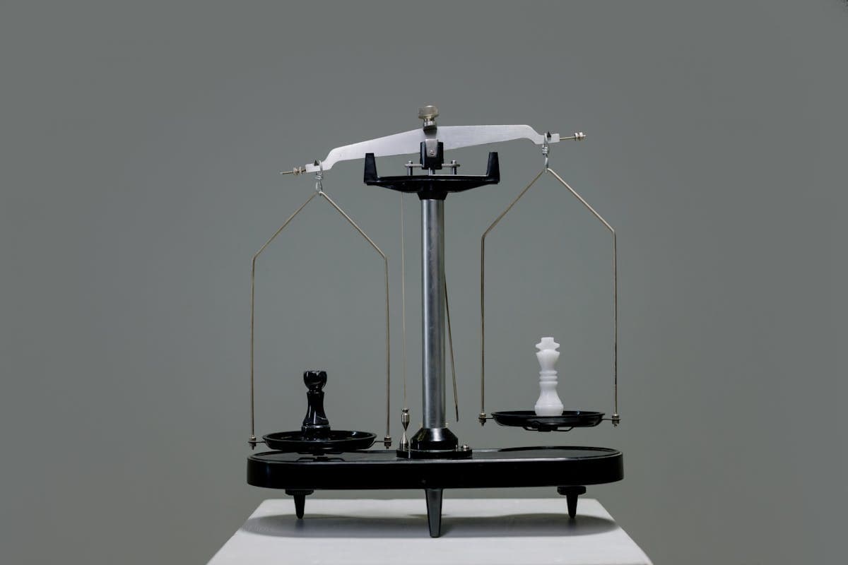 Chess pieces balanced on a scale — symbolizing the balance of AI strengths and weaknesses