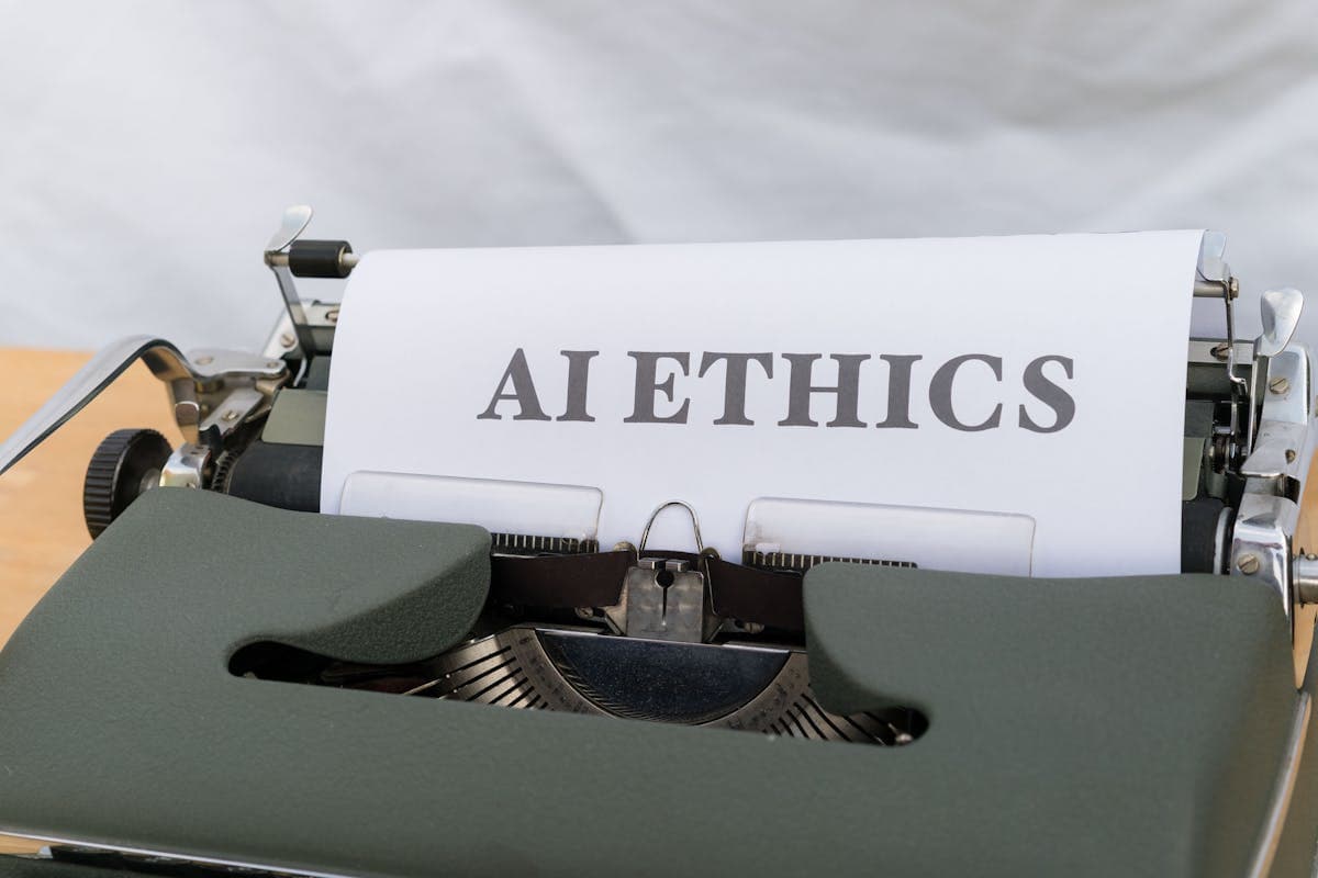 Typewriter with 'AI Ethics' text — symbolizing ethical considerations in AI implementation
