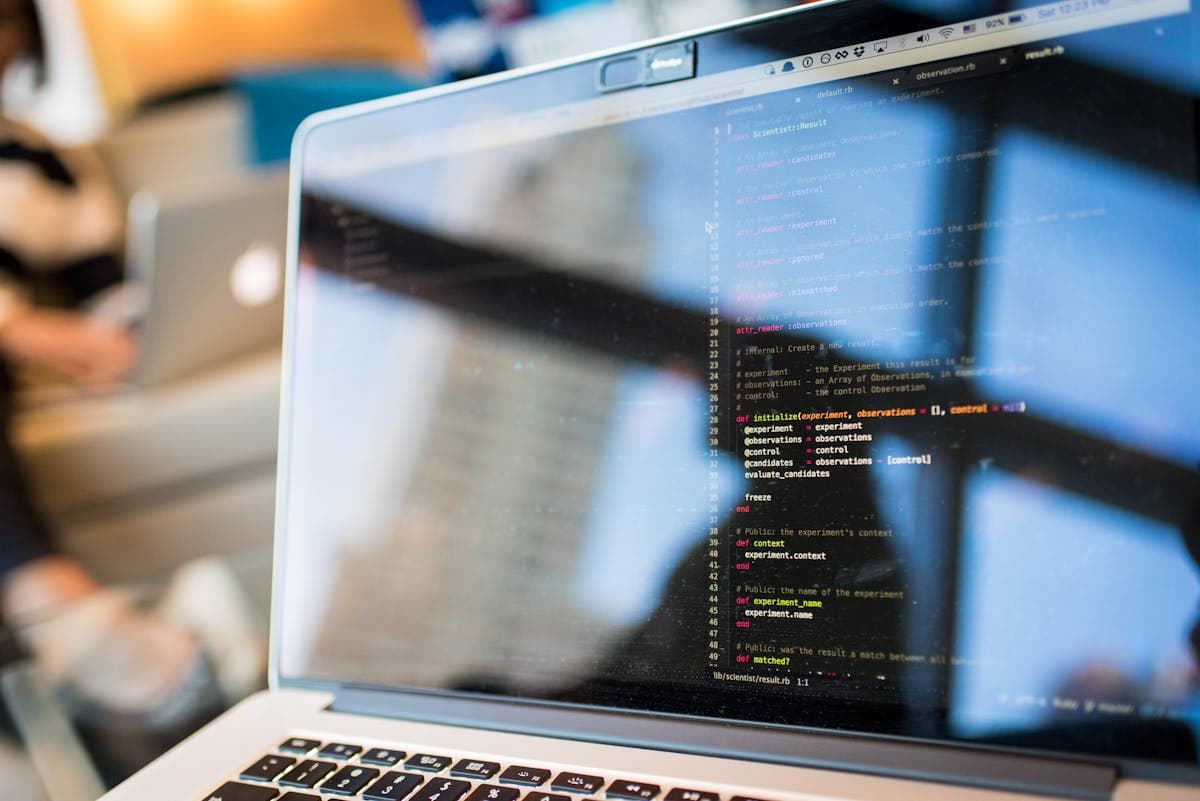 Code on computer screen — illustrating the choice between no-code and code-based AI agents